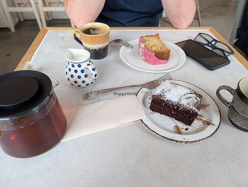 Vegan cake (foreground) and oat milk for drinks at Freya Café  in Skogar