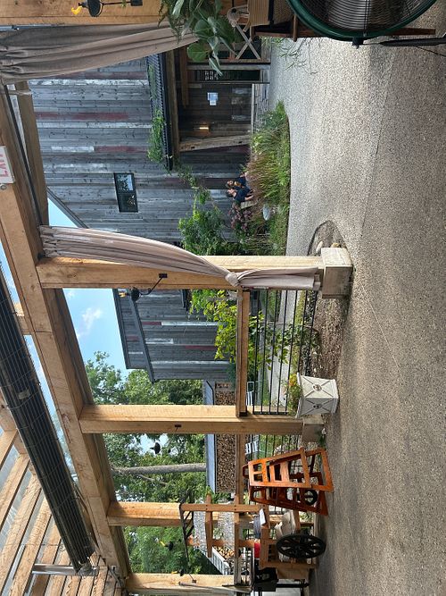 Outside patio with inside restaurant at the background   at Sylvan Table in Michigan