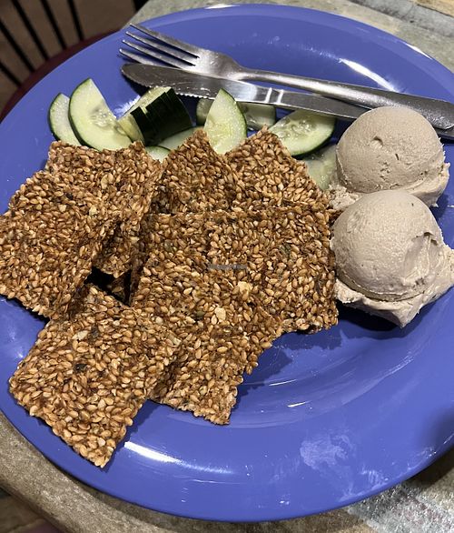Cashew Cheeze and Crackers- house made creamy cashew cheeze served with gluten-free flaxseed crackers and cucumber slices  at European Street Cafe  in Jacksonville