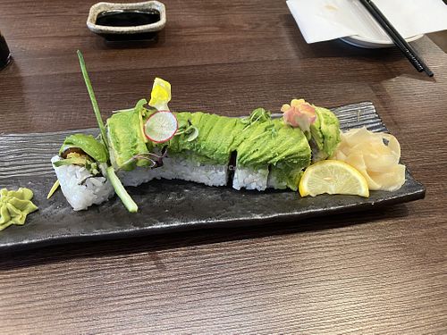 Caterpillar role with shiitake mushroom, yam, cucumber & edible flowers. Fresh & delicious, so much avocado on top!  at Cozen Japanese Cuisine in Vancouver