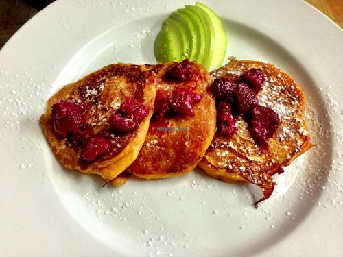 Sweet potato pancakes, served with seasonal fruit.
Gluten free.
The bottom gets caramelised, which makes it really yummy.
Lightly sweet and savoury at the same time. 
And quite greasy.  at Yuli's Lunch Box in Haifa