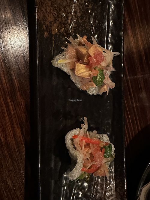 Tofu seasame crackers topped with finger lime   at Lost in Asia in Hobart