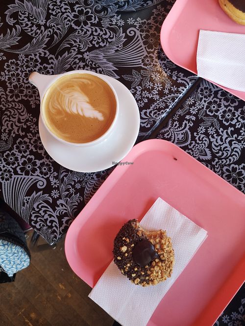 Chocolate Peanutbutter donut with coffee at Glam Doll Donuts - Eat Street in Minneapolis