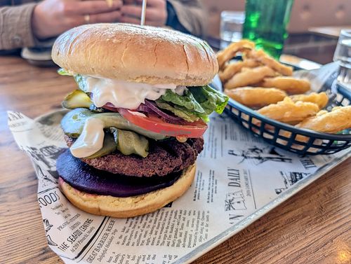The Vegan burger with beetroot & extra pickles. August 2025. at The Burger Hub Tas in Rosny Park