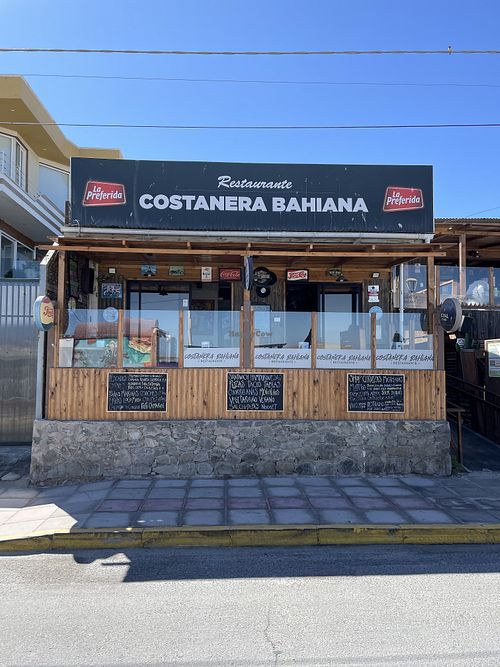 Restaurant front with sign advertising vegan options.  at Costanera Bahiana in Atacama