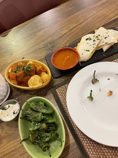 Patatas bravas, Padron peppers and quesadillas (excuse the peppers tops, I couldn’t help myself before taking the picture!)  at Tapas del Mundo (Swindon) in Swindon