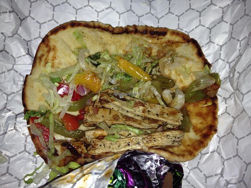 Baja Chicken flatbread with Beyond Meat Chicken, green & red peppers, onions, romaine lettuce, and jerk sauce. Yum! at Tropical Smoothie Cafe in Phoenix