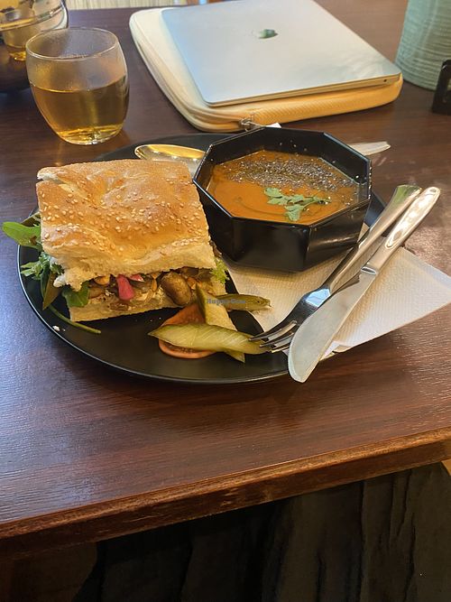 tomaten harissa soep, brood met labneh met gecarameliseerde ui en champignons  at Café Gilde in Amsterdam