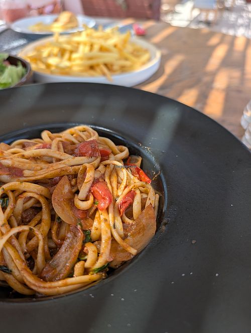 Tomato and basil linguini with portion of fries at The Boulevard sea.food.wine in New Jersey