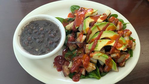 Side of black beans(they don't use meat broth or lard!), raw spinach, home fries, and avocado. at Food Bash in Winchester