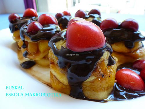 Delicious dessert made from apple and peches with a carob bean creamy sauce. at Baratza Kafea in Pamplona