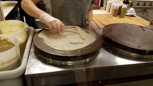 Making a crêpe! at Starving Artist Creperie and Cafe in Lee