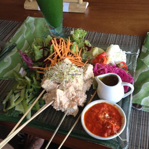 Tempe satay w/ Spicy peanut sauce and 'sautéed' Greens at Divine Earth in Seminyak