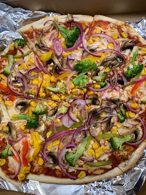 Build your own pizza with vegan cheese at Woodstone Pizza & Flamegrill Keswick in England