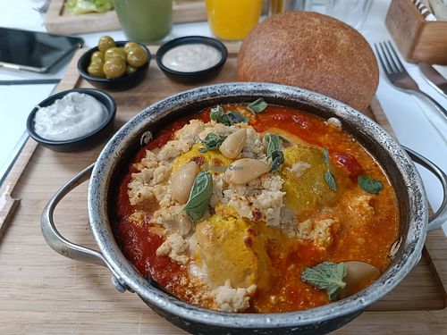 Hot Shakshuka plate with Fettah cheese on top at Anastasia in Tel Aviv