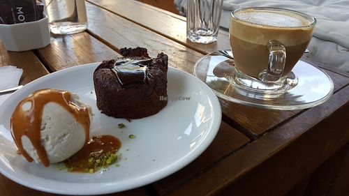 Soy milk coffee and warm chocolate cake with ice cream in hazlenut butter at Anastasia in Tel Aviv