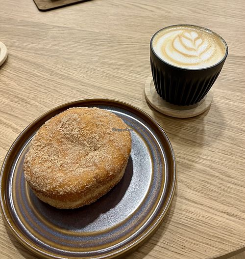 Chocolate lava churro and flat white    at Podda & Wren Coffee Roasters  in England