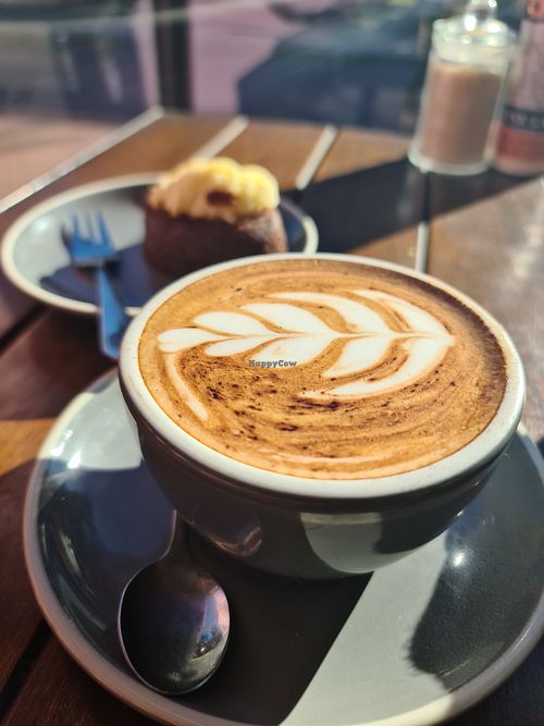 Almond milk coffee in the sun at Dad and Dave's Cafe in Yarraville