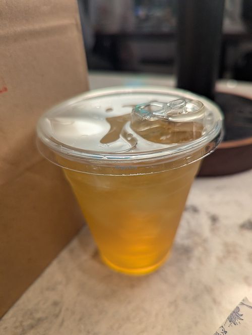Unsweetened peach mango iced green tea at {petite} maman in New York