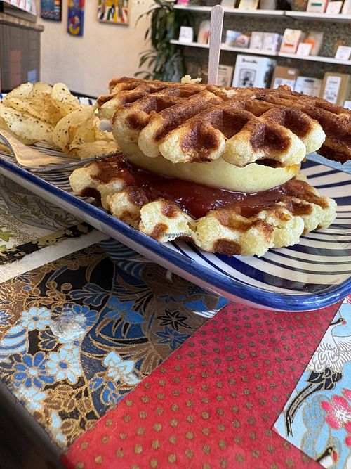 VcGRIDL: vegan Belgian Liege waffles, Just Egg, vegan cheese, tempeh sausage patty, tomato jam, maple syrup    at Torque Coffee in San Diego