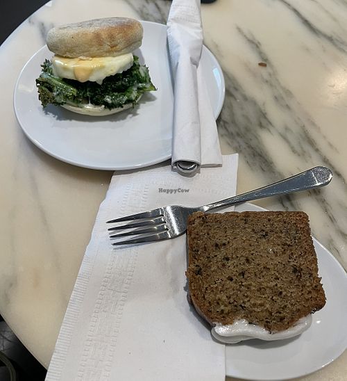 Vegan Earl Grey Lemon Loaf on the right. The dish on the left is a vegetarian egg and kale sandwich.   at Bel Café Downtown in Vancouver