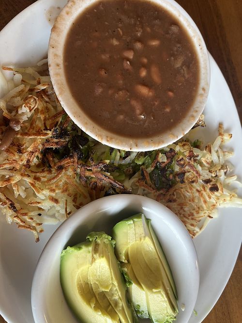 Hash browns with peppers and onions, beans, and avocadoo  at Boogies Restaurant in Del Norte