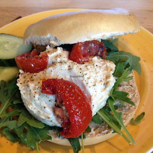 Hummus with sun dried tomato and rucola bagel at Bagels & Beans - IJDok in Amsterdam