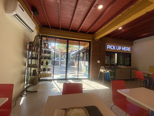 Inside seating very clean and nice - Indian tunes playing  at Accha Indian Dhaba in Chiang Mai