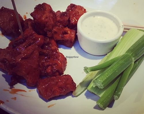 Gardein buffalo wings (the dip isn't vegan) they are quite spicy! at Yard House in Miami