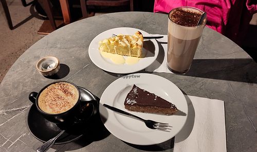 Cappuccino, hot chocolate, chocolate cake, apple cake with vanilla sauce. at Cafe Roasberg (3 Linja) in Helsinki