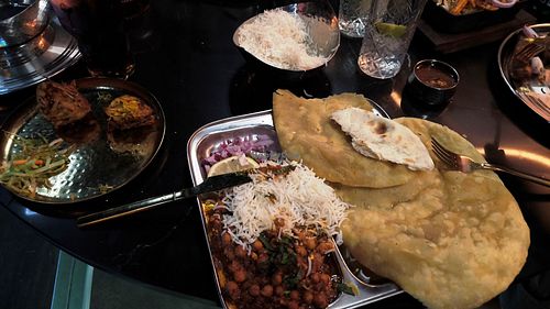 CHOLE BHATURE with sides of rice and Onion Bhaji at The Bar of Spices and Spirits Bolton  in Bolton