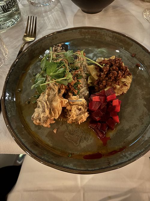 Baked egg plant fried in a crunchy batter with a tasty cabbage side  at Waber. in Overijssel
