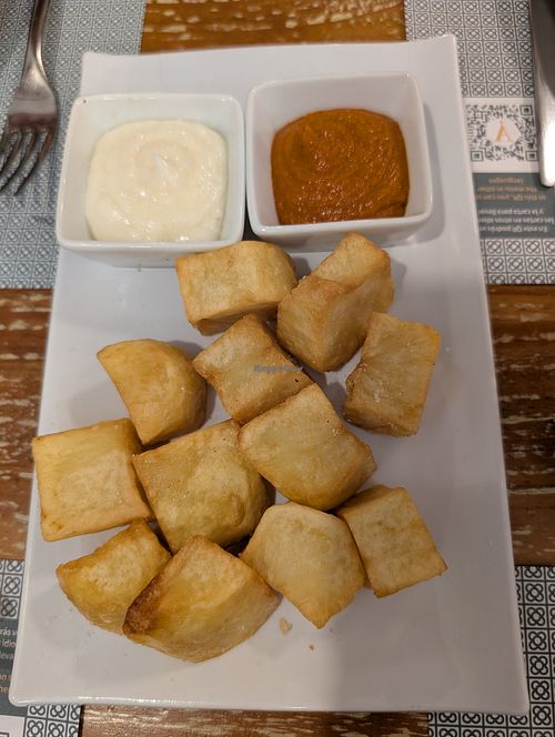 Patatas bravas (omit white sauce for vegans) at Restaurant L'Arrosseria Xativa in Catalunya