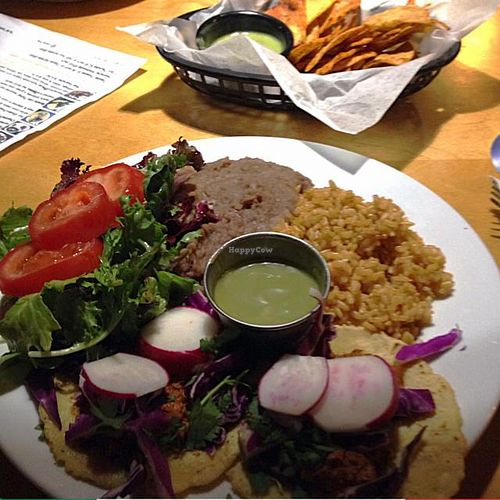 Taco Thursday plate with chips and salsa in the background at Flacos in Fresno