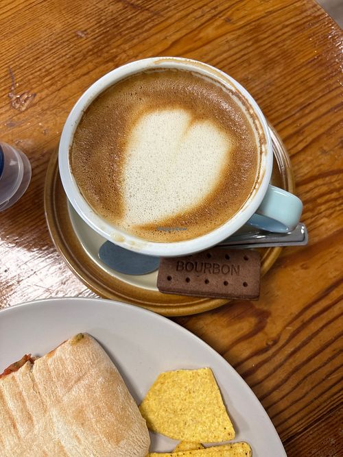 Vegan Autumnul latte, falafel and tomato pannini. Vegan biscuit    at  Big Mugs in England
