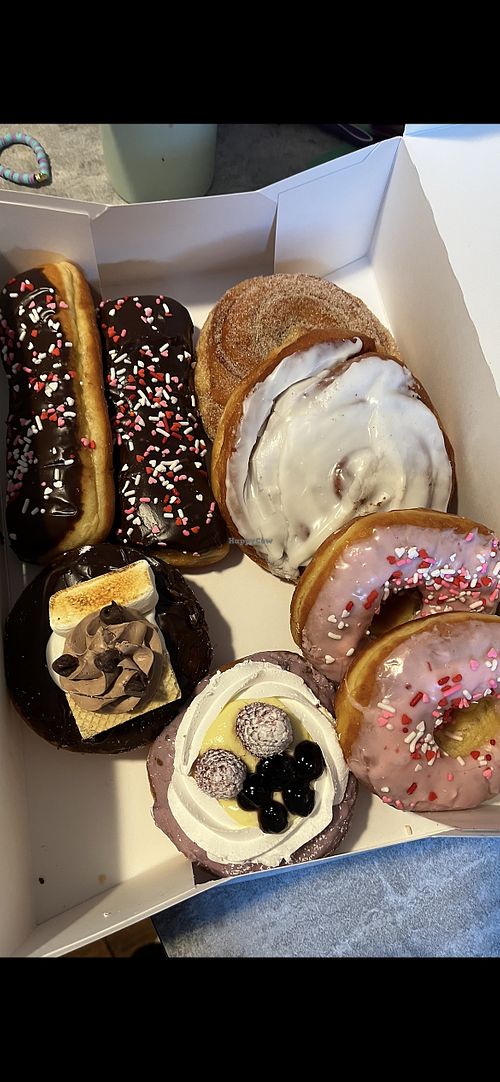 Two chocolate frosted long johns, cinnamon sugar topped cinnamon roll, vanilla frosting topped cinnamon roll, s’mores, mixed berry, two strawberry frosting topped donuts  at Uffda Donuts in Blaine