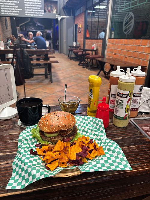 Lentil burger with additional chips and coffee. The menu isn't entirely vegan; you need to specify. (I am not vegan and did not mind that mine had cheese). at Aura Gastro Experiencias in Puebla