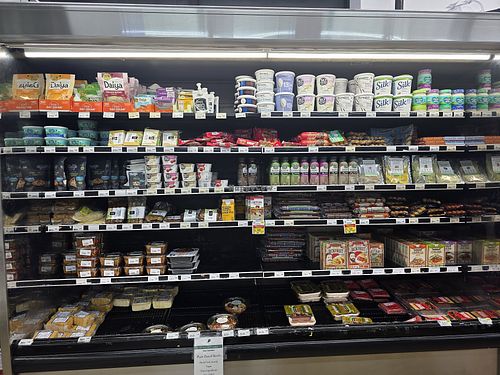 Vegan section with tofu, tempeh, seitan, vegan yogurt, and vegan cheese at HarvesTime Foods in Chicago