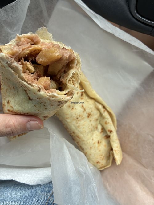Tore the burrito in half to show the bean and potato. Believe it was french fries.  at Marfa Burritos in Marfa