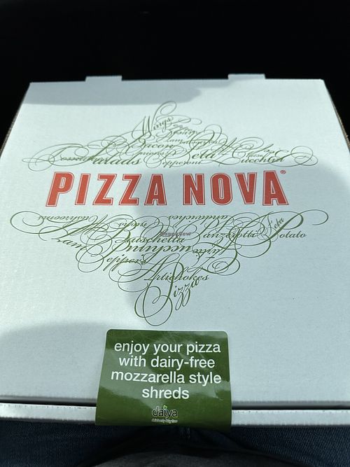 Sticker used to show that this pizza has vegan mozzarella.  at Pizza Nova in Mississauga