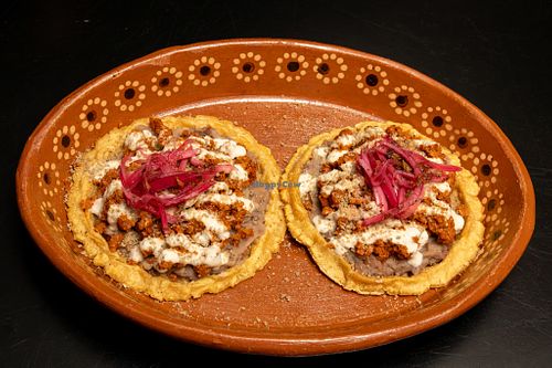Chorizo Sopes
Two thick corn dough bases topped with beans, seed chorizo, cream and pickled onions (2 pcs) at El Tesorito de Jalisco in Mexico City
