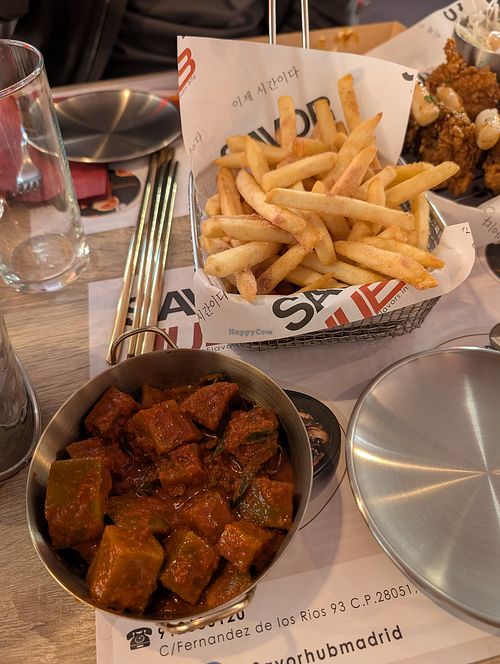 kimchi and fries with plum powder at Savor Hub - Korean Fried Chicken in Comunidad De Madrid