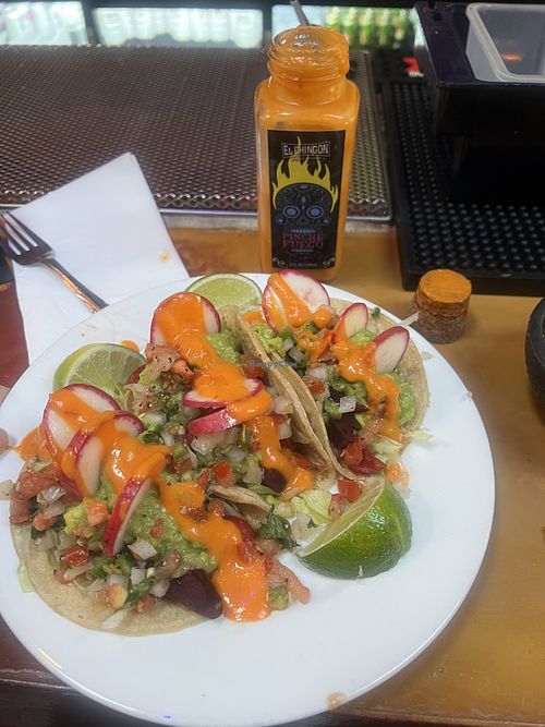 Vegan tacos and hot sauce. So good!!! Big flavor!   at El Chingon in San Diego