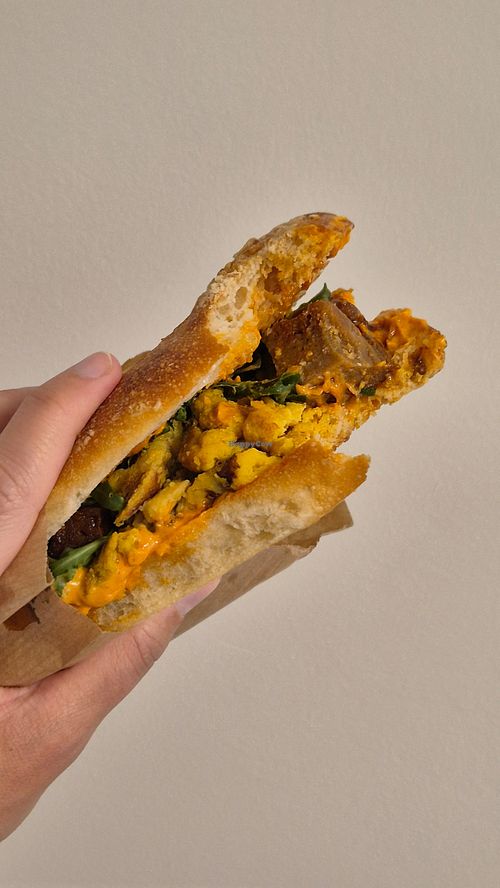 I always take bites before taking photos. Can confirm the sandwiches are perfect! at Kitsune Athens Bistrot in Athens