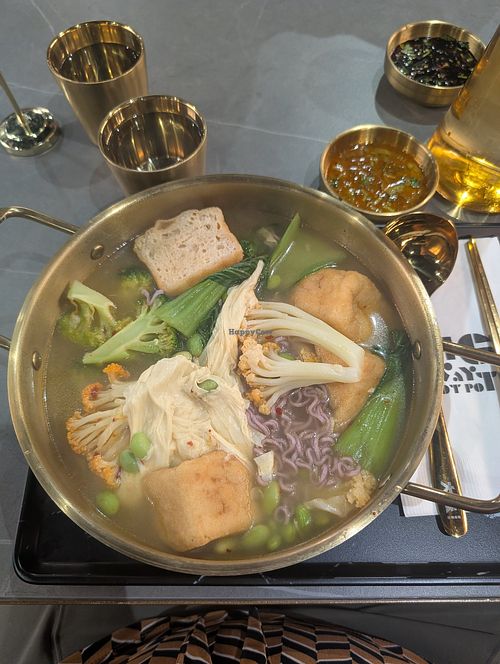 Vegan broth with purple yam noodles and fried tofu at Big Way Hot Pot (K-town) in Toronto