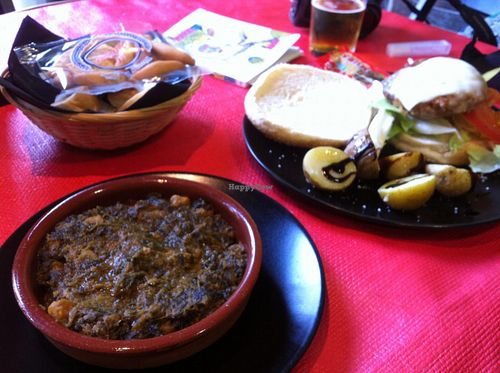 Espinaca con garbanzo (spinach with chickpeas, sooo tasty!) and Burgers.  at Vegan Rock in Sevilla