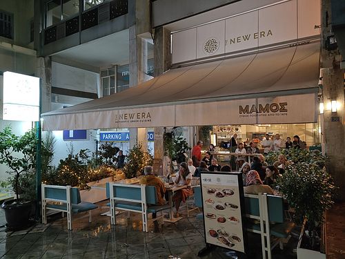 Leafy outdoor seating at The New Era Authentic Greek Cuisine  in Athens