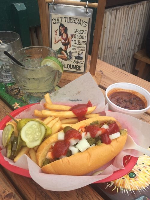 Vegan hotdog with vegan chilli and a house margarita.  at South Shore Tiki Lounge in Kihei
