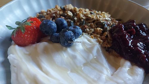 Granola with coconut yoghurt and cherry compote at Nourish Cafe in England