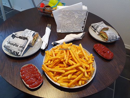 Big portion of french fries with ketchup, and vegan sandwiches at Mulles madglæde in Nyborg